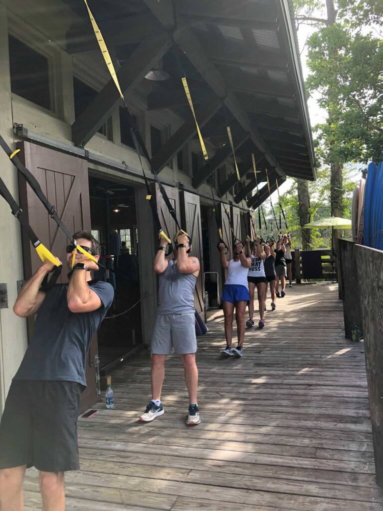 group doing TRX bicep curls